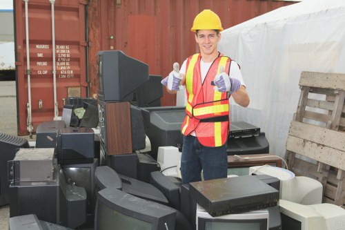 Furniture being loaded into a truck for disposal in Norwood.